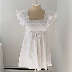 White babydoll dress with flutter sleeves